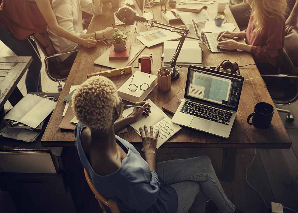 a small group meeting around a table